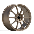 10 spoke bronze forged alloy wheel with white background.