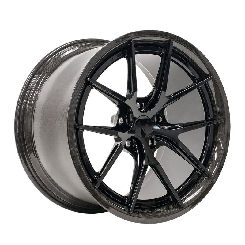 Black carbon barrel forged alloy wheel on white background.