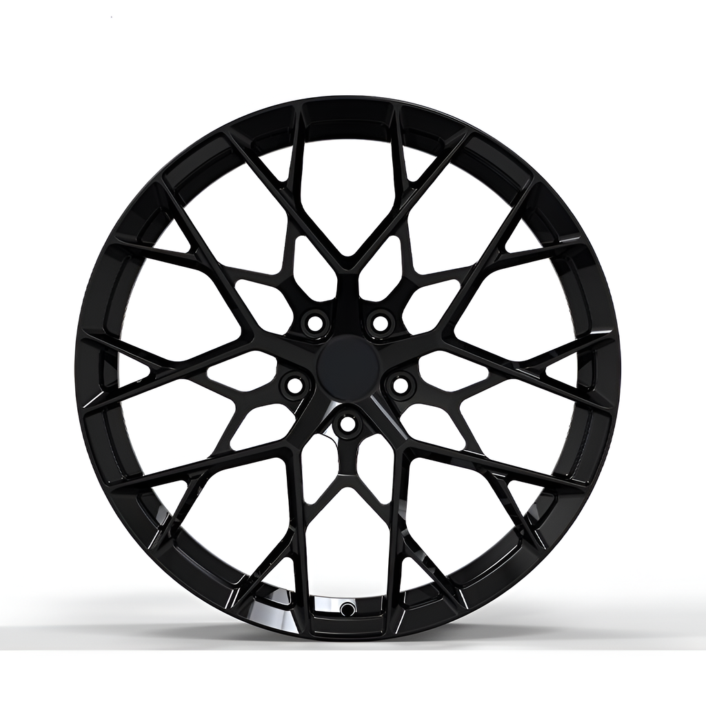 Black forged alloy wheel on white background.