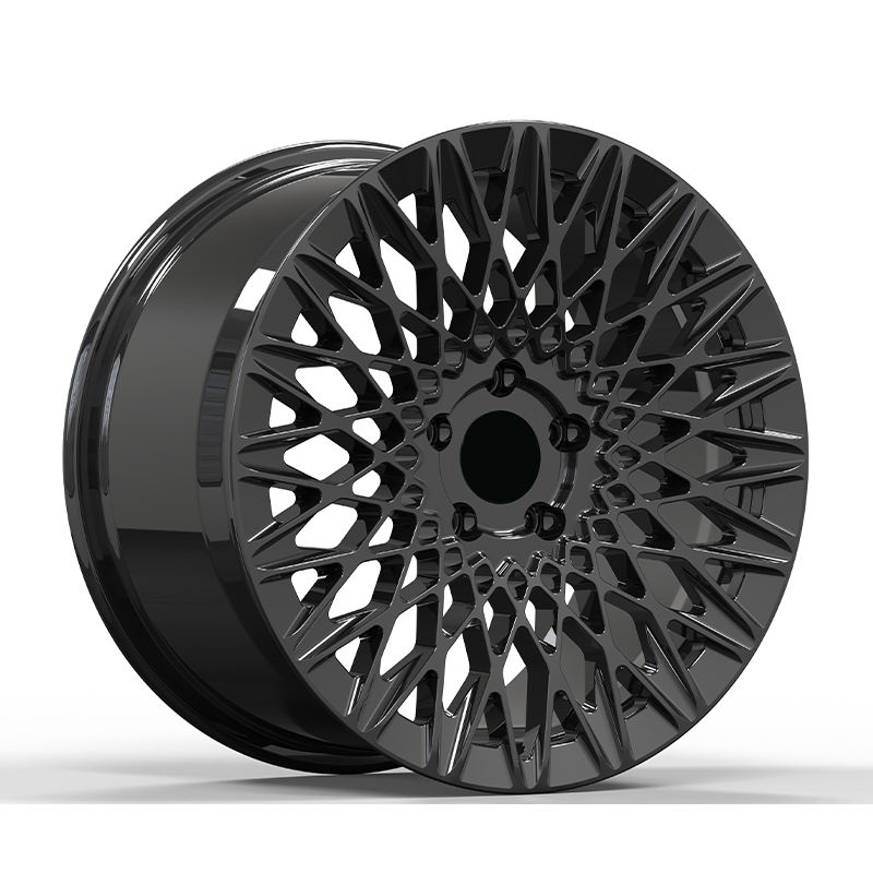 Black lattice style forged wheel on white background.