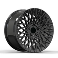 Black lattice style forged wheel on white background.