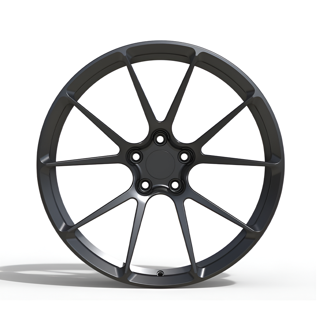 Black forged alloy wheel on white background