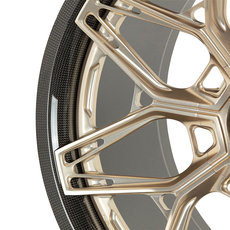 Gold carbon barrel forged alloy wheel on white background