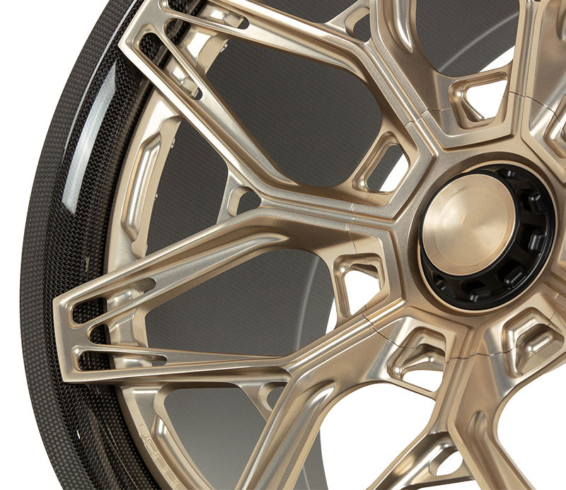 Gold carbon barrel forged alloy wheel on white background