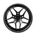 Black carbon barrel forged alloy wheel on white background