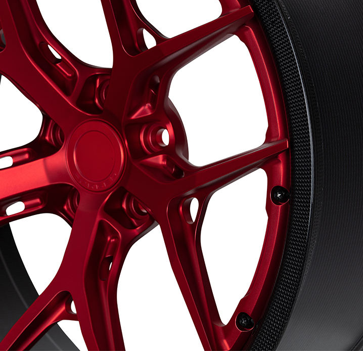 Red carbon barrel forged alloy wheel on white background